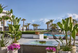 08-talos-lobby-bar-with-veranda-overlooking-the-pool-and-gardens